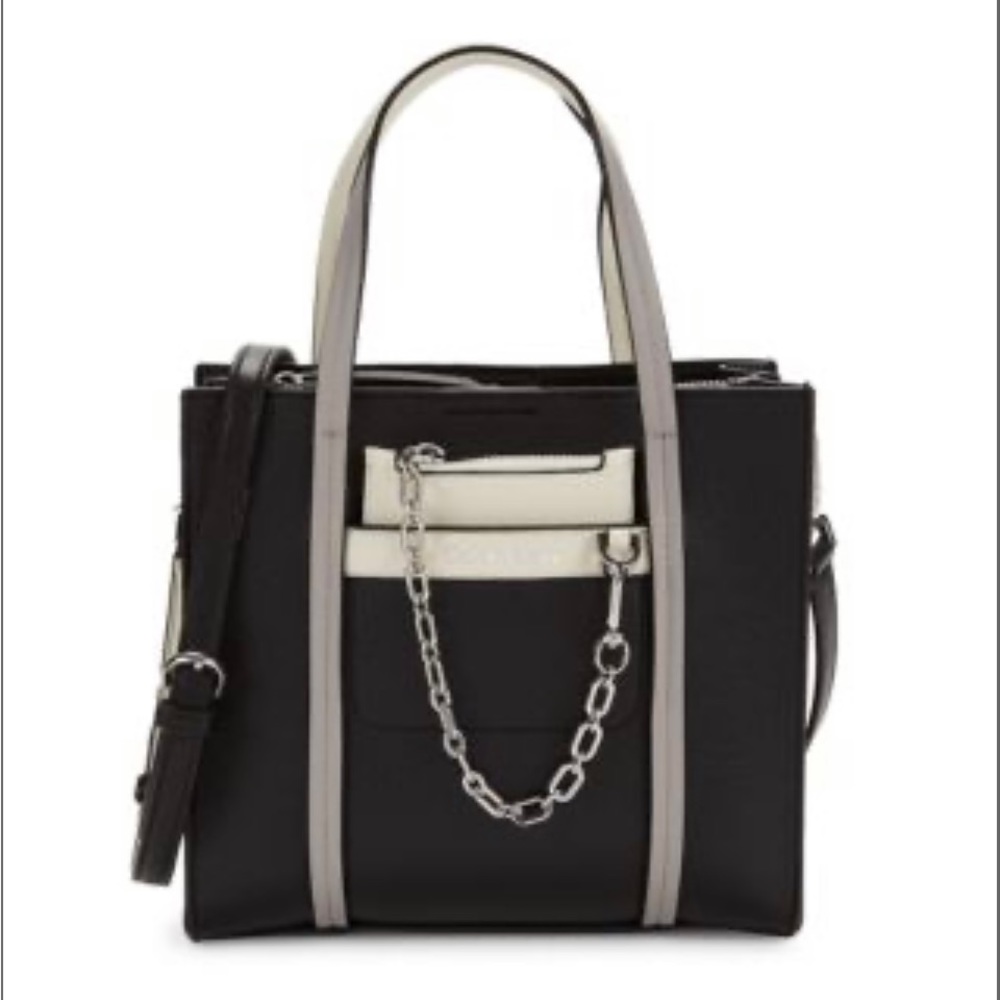 Elegant and versatile Calvin Klein black purse with white accents.